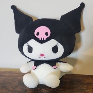Black and White Plush Toy with Pink Accents